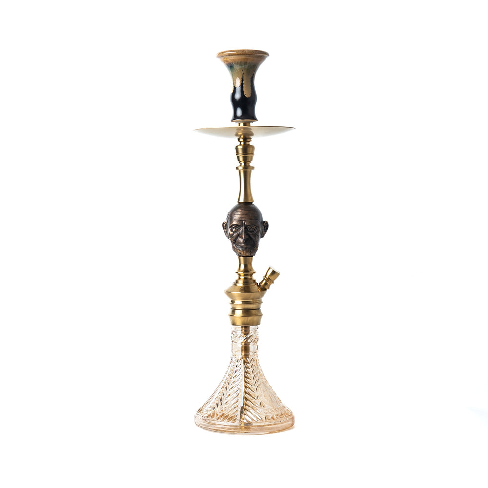 Decorative hookah with a face design on a white background